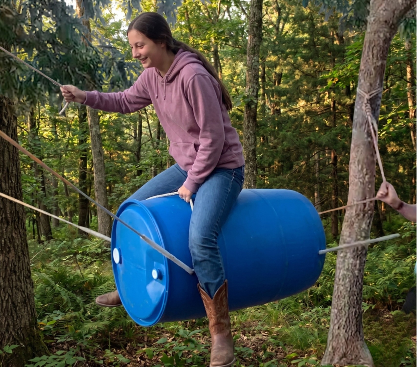 Jasmine riding a barrel suspended between two trees, the original inspiration for Fu Manchu