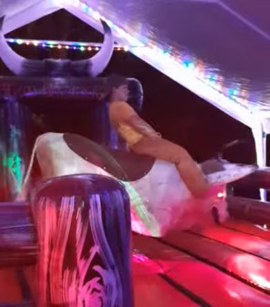 Rider on Fu Manchu the mechanical bull at night