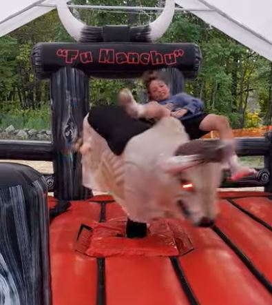 Rider falling off Fu Manchu the mechanical bull, motion blur