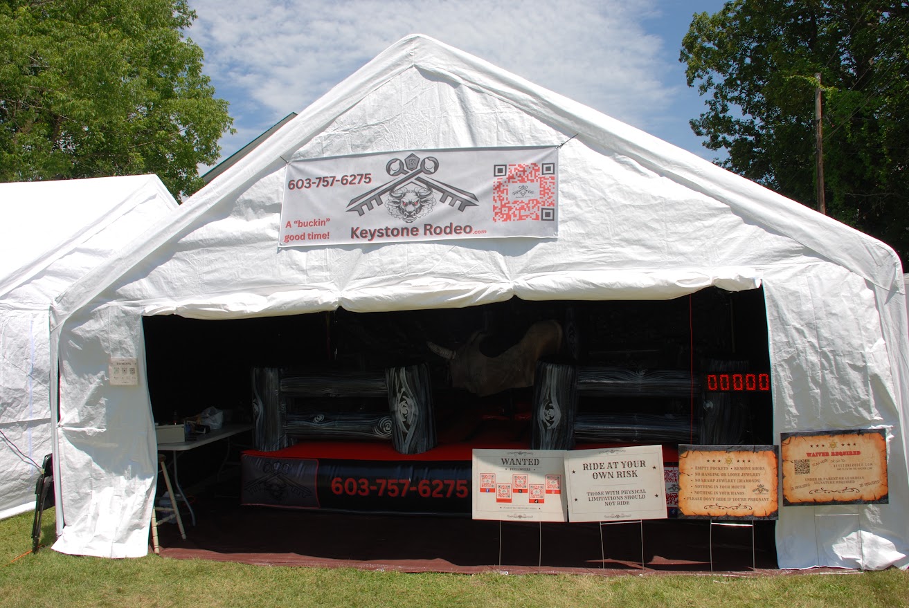 Keystone Rodeo tent set up at a fair with the mechanical bull inside