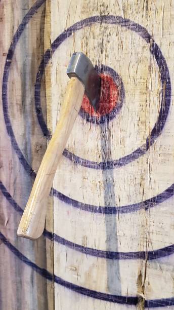 Axe stuck in the bullseye of a throwing target